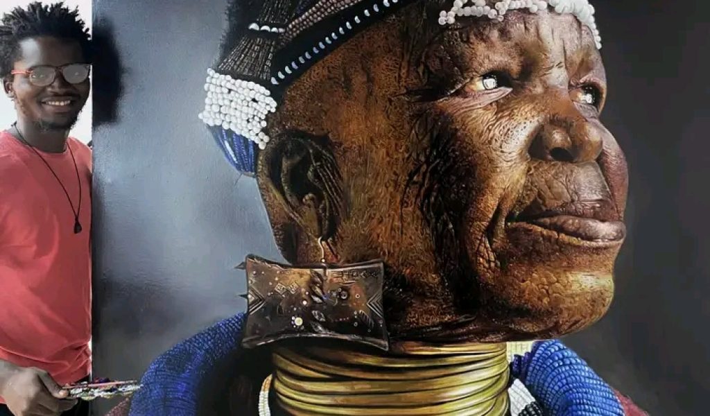 Mbenga présente son œuvre.